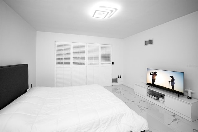 bedroom featuring marble finish floor and visible vents