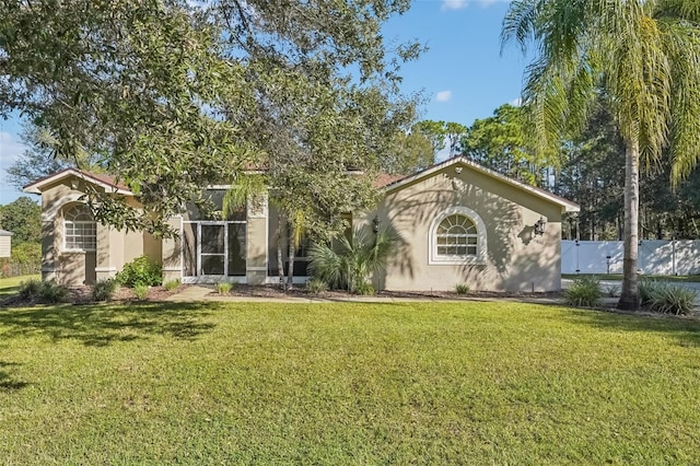 rear view of house with a lawn