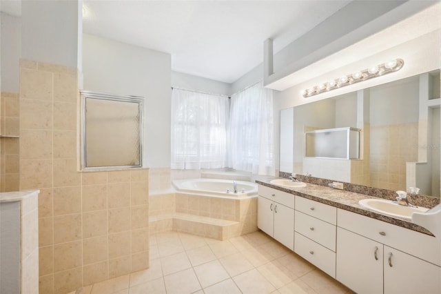 bathroom featuring vanity, independent shower and bath, and tile patterned floors