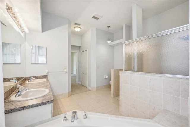 full bathroom with vanity, plus walk in shower, toilet, and tile patterned flooring