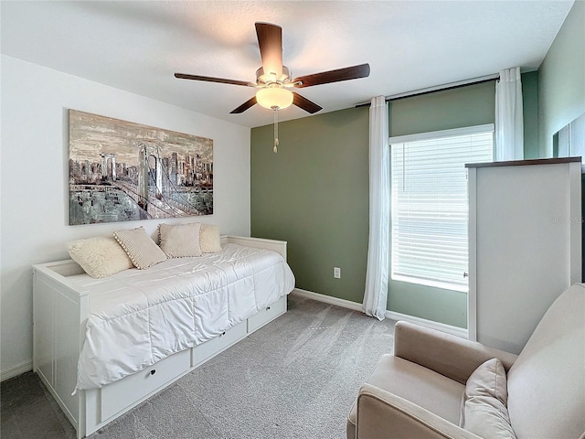 carpeted bedroom with ceiling fan