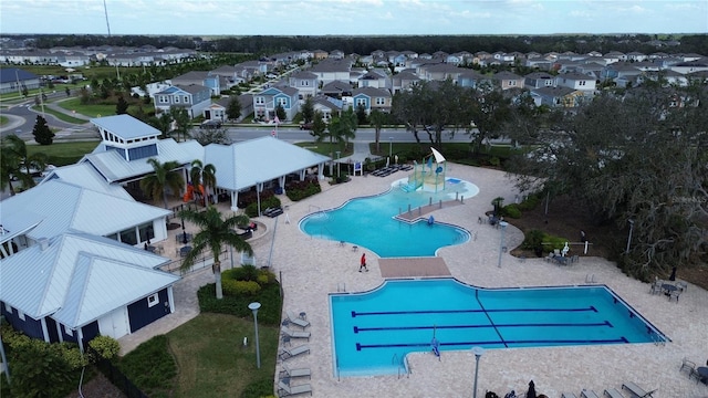 view of swimming pool with a patio