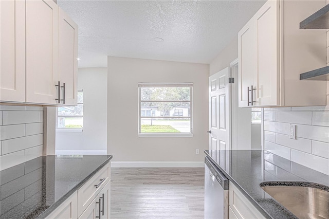 kitchen with white cabinetry and plenty of natural light