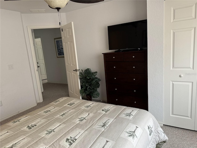 bedroom featuring light colored carpet and ceiling fan