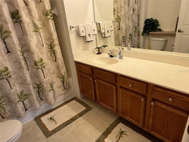 full bathroom featuring vanity, toilet, and shower / tub combo