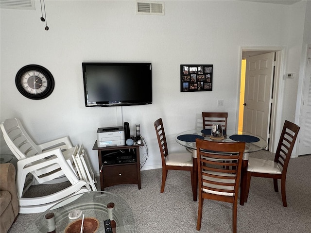 dining space with carpet flooring