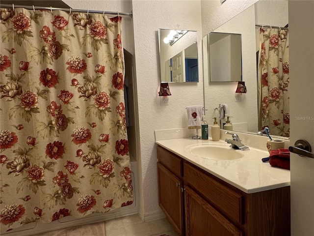 bathroom with vanity and tile patterned flooring