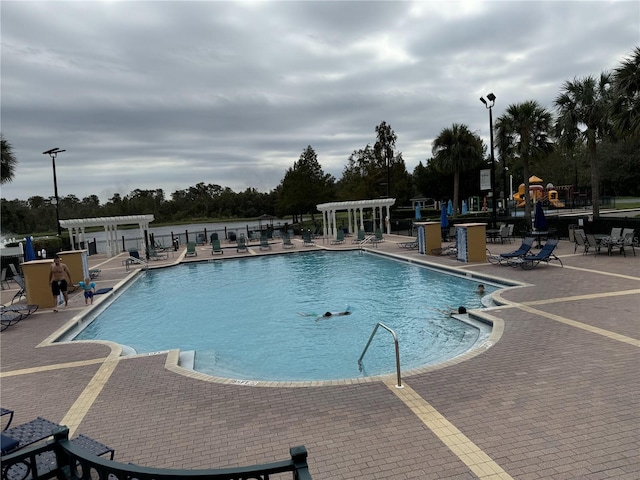 view of swimming pool featuring a patio area