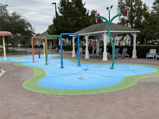 exterior space featuring a gazebo and a playground