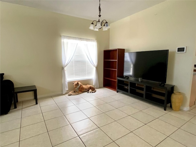 tiled living room featuring a notable chandelier