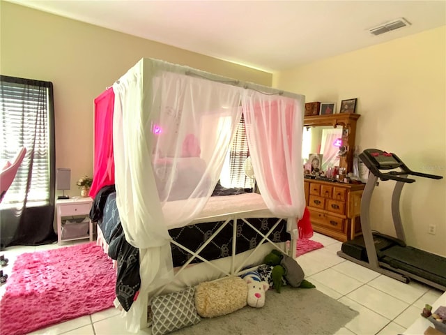 bedroom with light tile patterned flooring