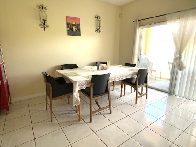 dining area with light tile patterned flooring