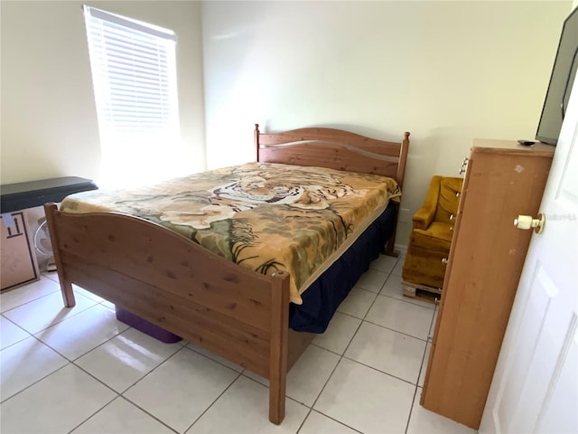 bedroom featuring light tile patterned floors