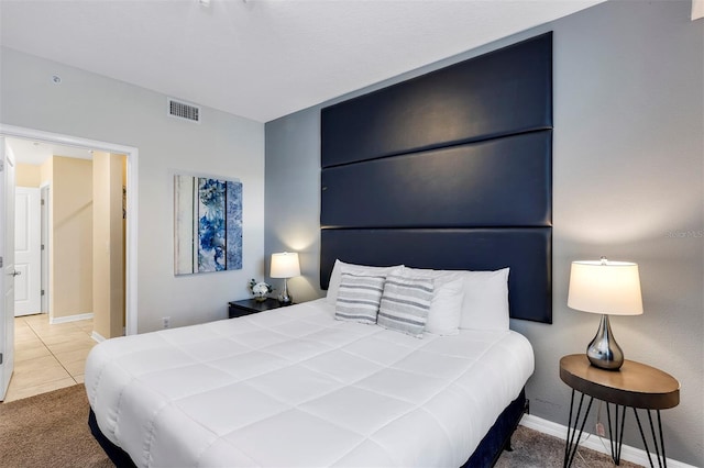 bedroom featuring light colored carpet