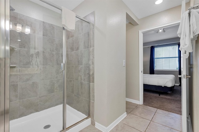 bathroom with tile patterned flooring and an enclosed shower