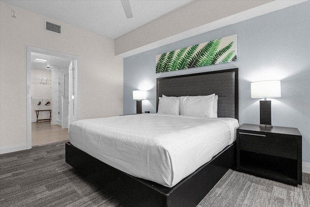 bedroom with ensuite bath, hardwood / wood-style flooring, and ceiling fan