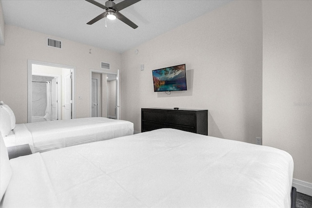 bedroom featuring ensuite bath and ceiling fan