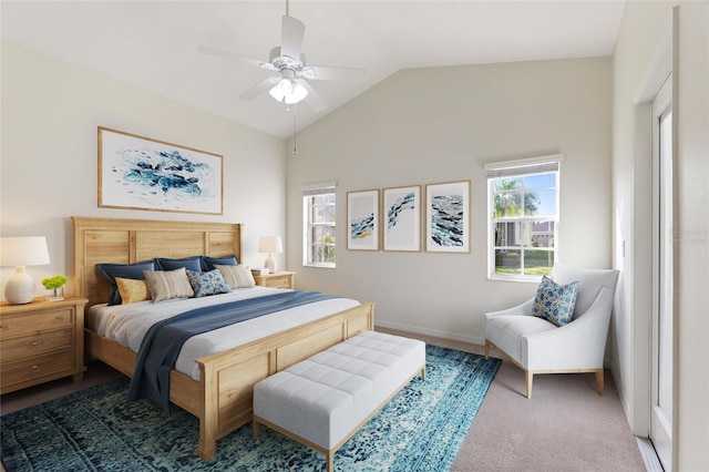 carpeted bedroom with vaulted ceiling and ceiling fan