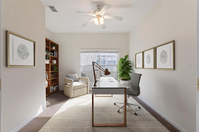 home office with light colored carpet and ceiling fan