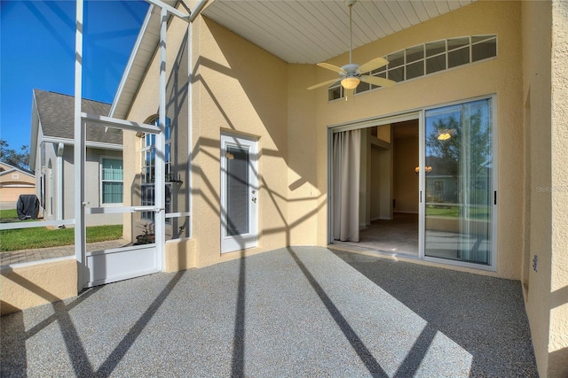 view of patio featuring ceiling fan