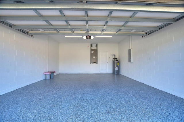 garage featuring a garage door opener, electric panel, and water heater