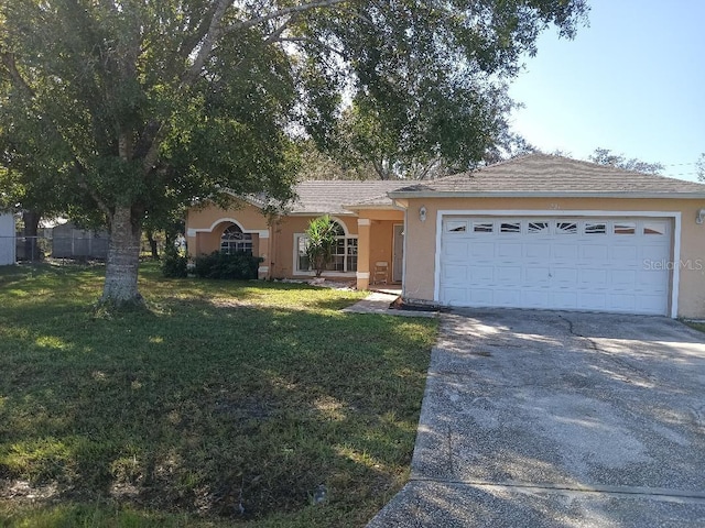 ranch-style home with a garage and a front lawn