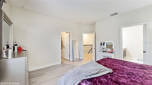 bedroom with light wood-type flooring