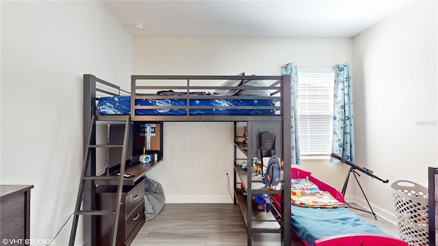 bedroom featuring wood-type flooring