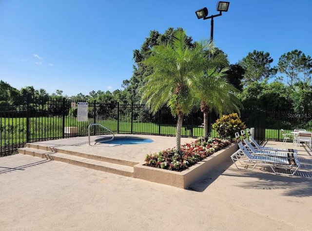 view of pool featuring a patio