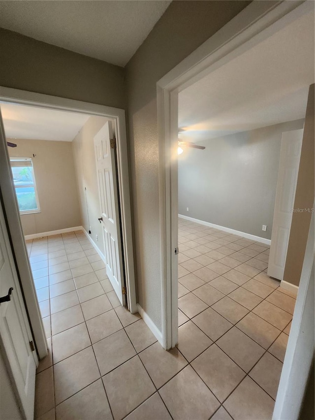 hallway featuring light tile patterned flooring