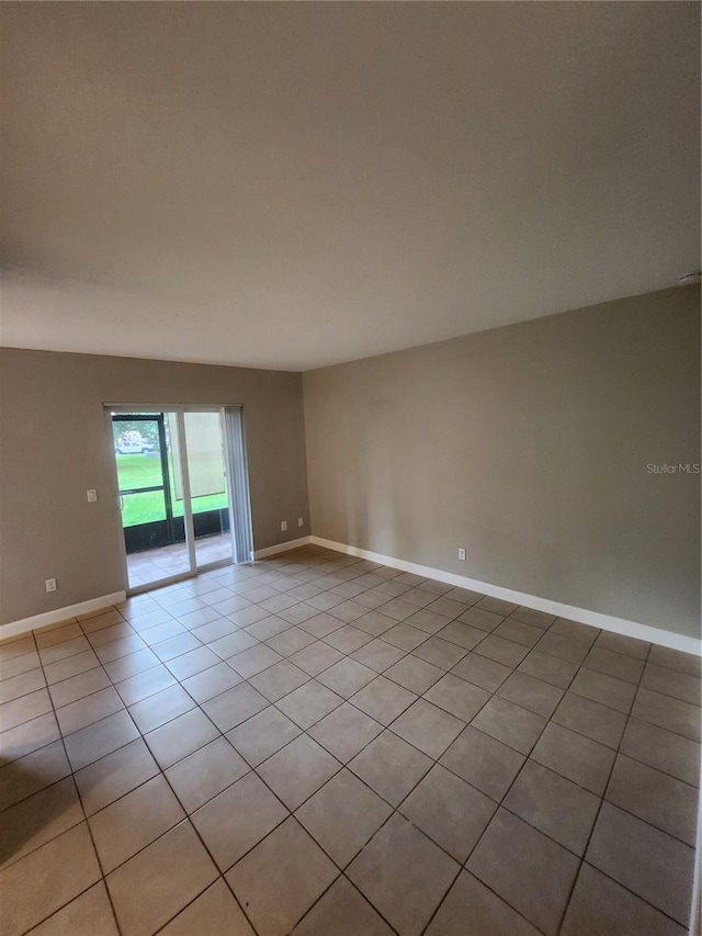 unfurnished room with light tile patterned floors