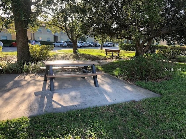 view of home's community with a yard