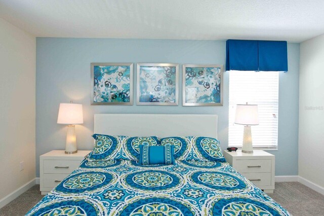 4839 Kings Castle Cir, Kissimmee, FL 34746 - bedroom with light carpet and baseboards