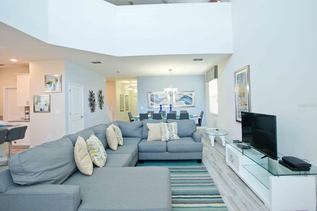 4839 Kings Castle Cir, Kissimmee, FL 34746 - living area with a chandelier, light wood-style flooring, and recessed lighting