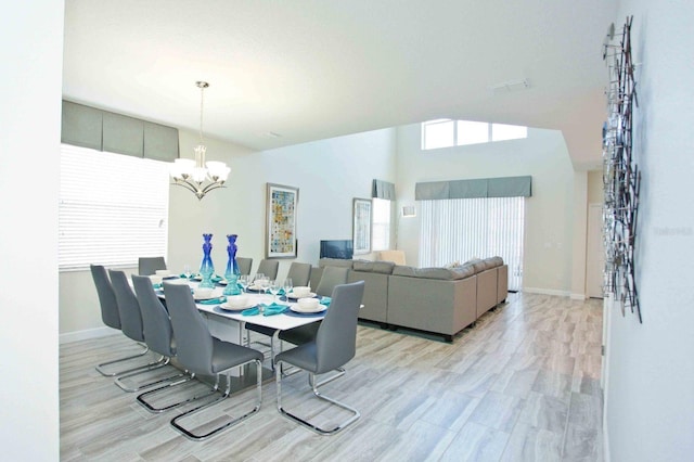 dining area featuring a chandelier and light hardwood / wood-style floors