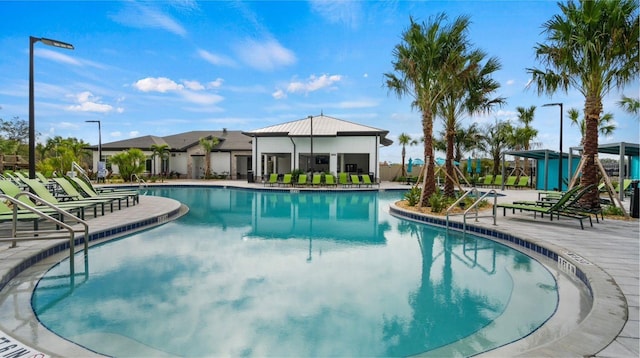 view of swimming pool featuring a patio area