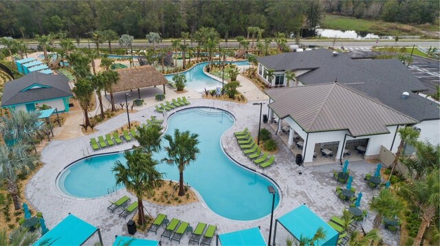 view of swimming pool with a water view