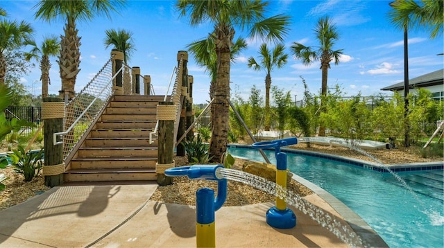 view of pool with a jacuzzi