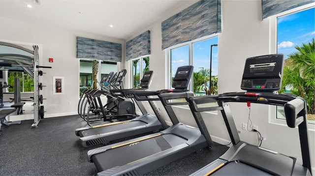 4839 Kings Castle Cir, Kissimmee, FL 34746 - workout area with plenty of natural light, baseboards, a towering ceiling, and recessed lighting
