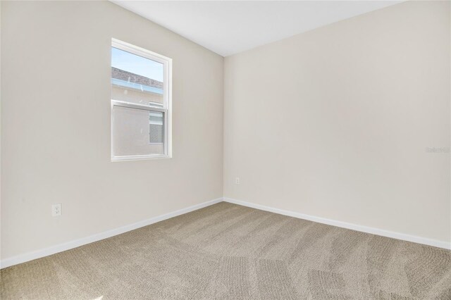 unfurnished room featuring carpet flooring