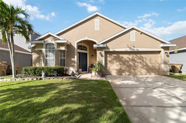 view of front of home with a front lawn and a garage