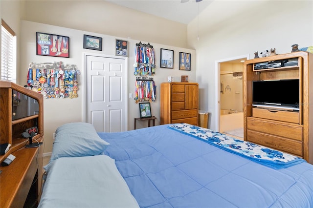 bedroom featuring a closet and ensuite bath