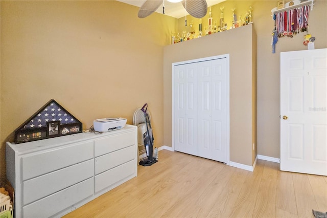 bedroom featuring a closet, ceiling fan, and hardwood / wood-style floors