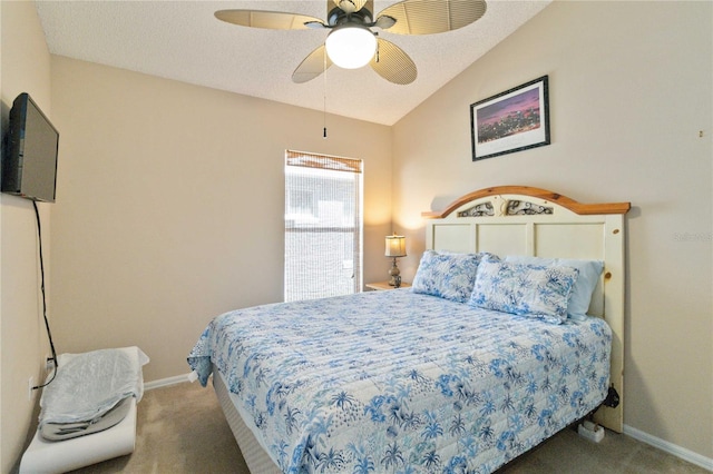 bedroom featuring carpet, vaulted ceiling, a textured ceiling, and ceiling fan