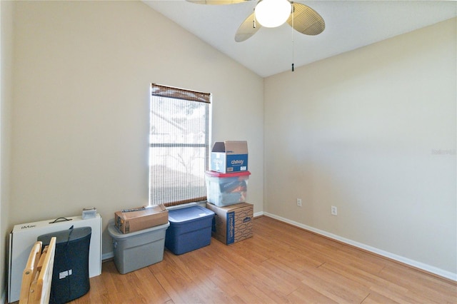 misc room featuring ceiling fan, wood-type flooring, and vaulted ceiling