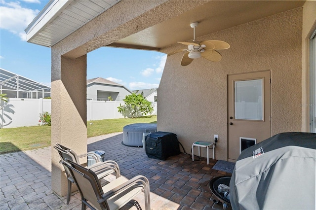 view of patio / terrace with area for grilling and ceiling fan