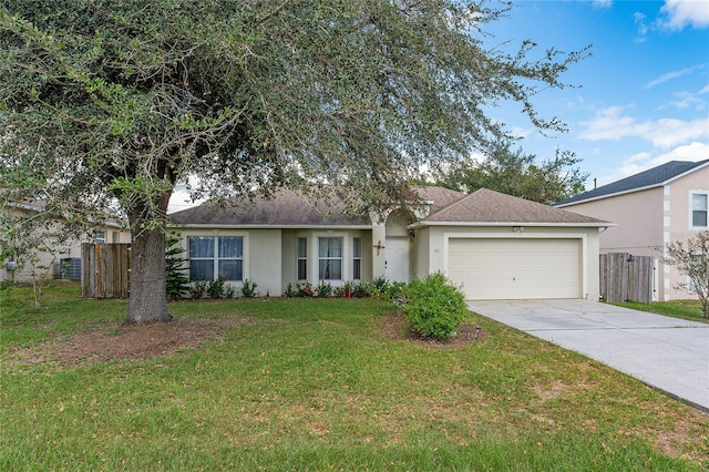 ranch-style home with a garage and a front lawn