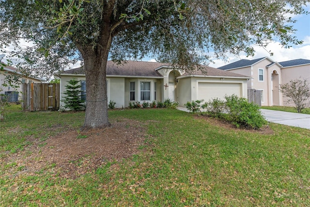 single story home with a front yard and a garage