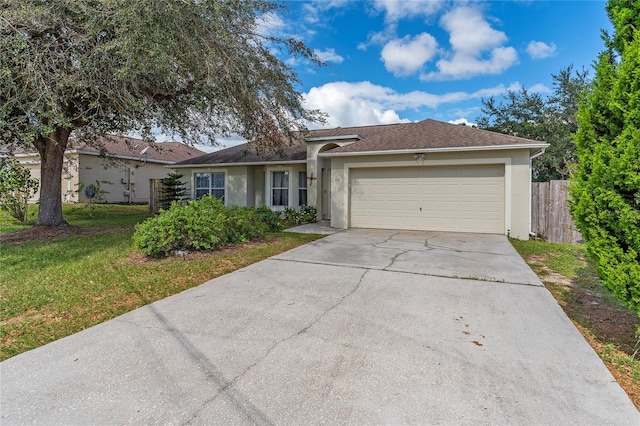 ranch-style house featuring a front lawn and a garage