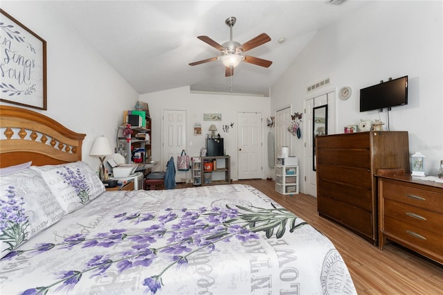 bedroom with lofted ceiling, light wood-type flooring, and ceiling fan